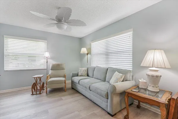 a living room with furniture and a window