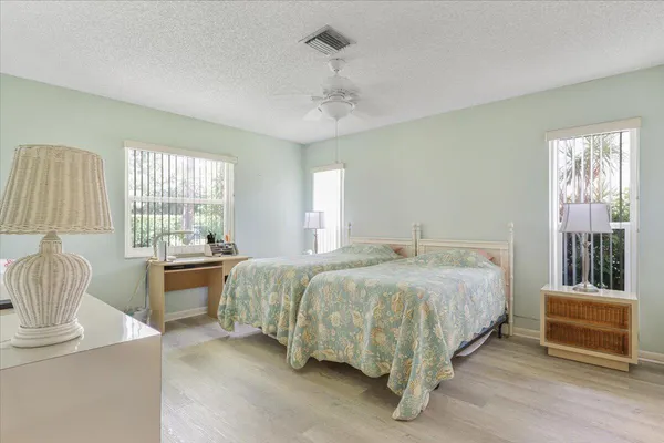 a bed room with a bed and a window