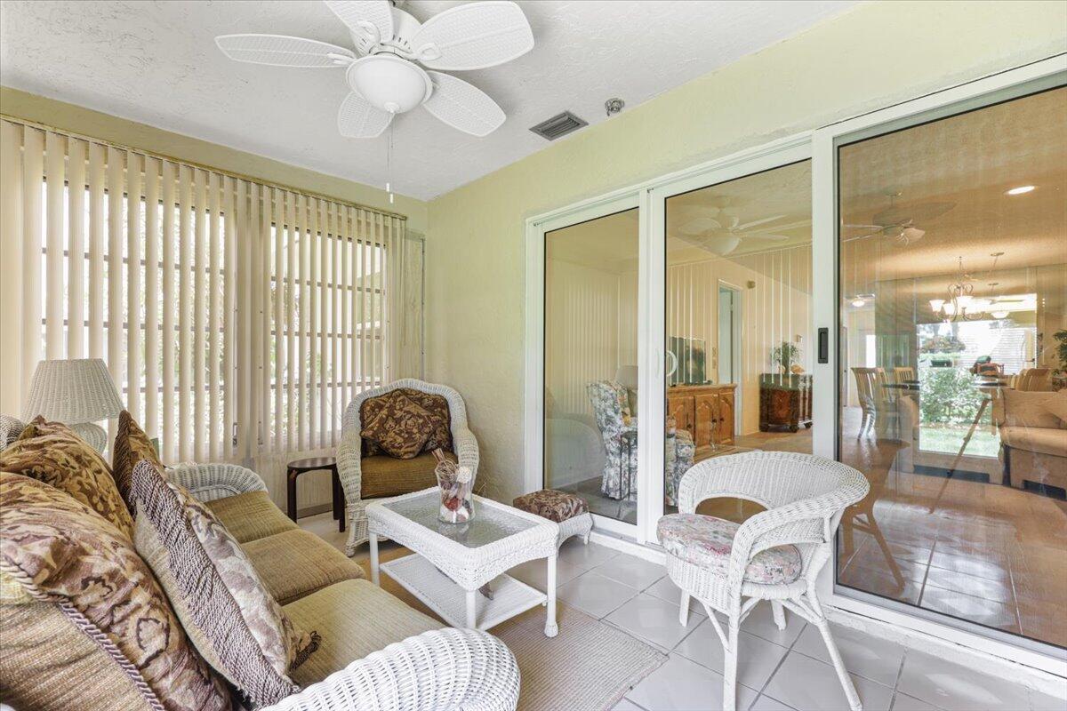 5178 Privet Place, Unit D Delray Beach, FL 33484 - Photo 27 of 41 a living room with furniture and a window