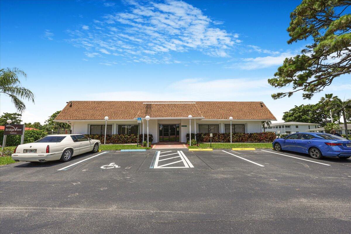 5178 Privet Place, Unit D Delray Beach, FL 33484 - Photo 30 of 41 a car parked in front of the house