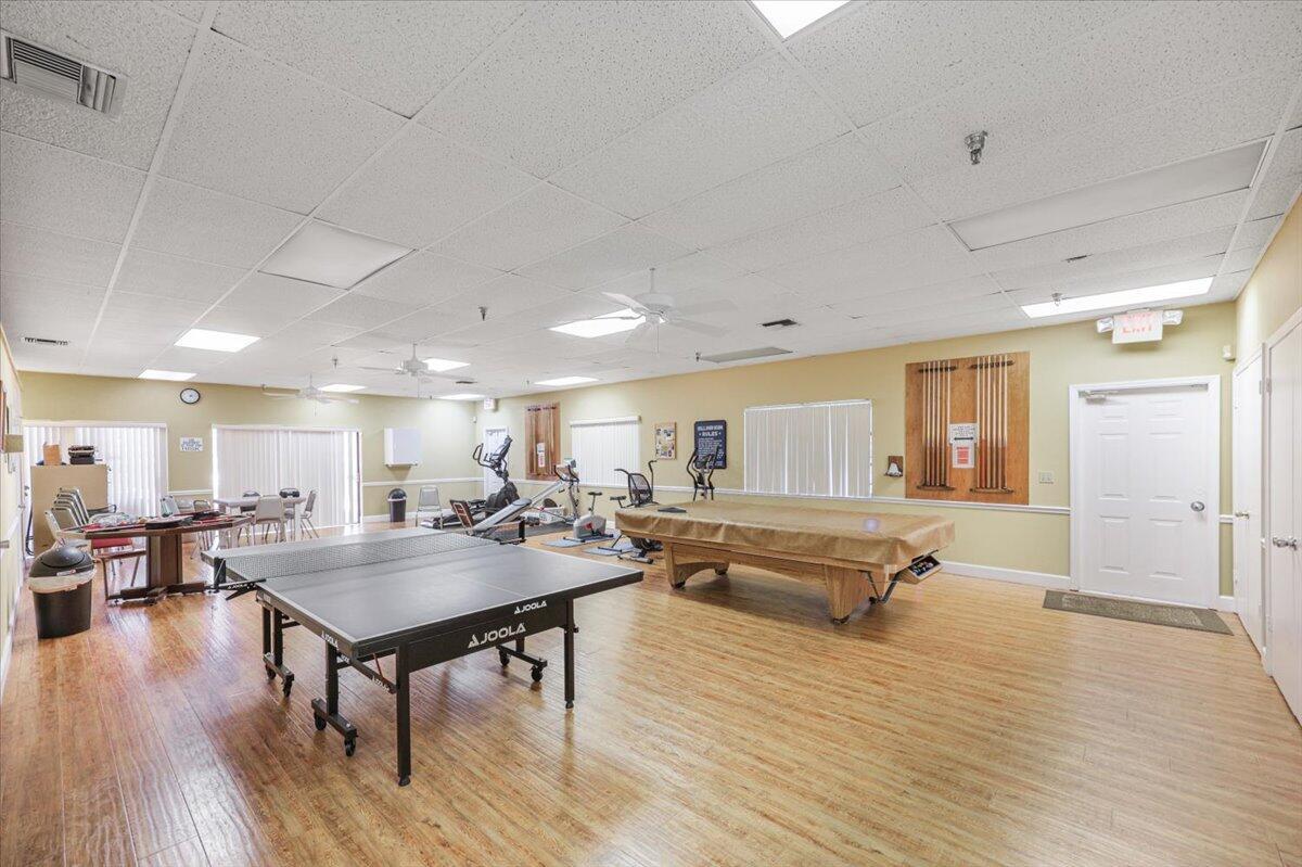 5178 Privet Place, Unit D Delray Beach, FL 33484 - Photo 35 of 41 a living room with furniture and wooden floor