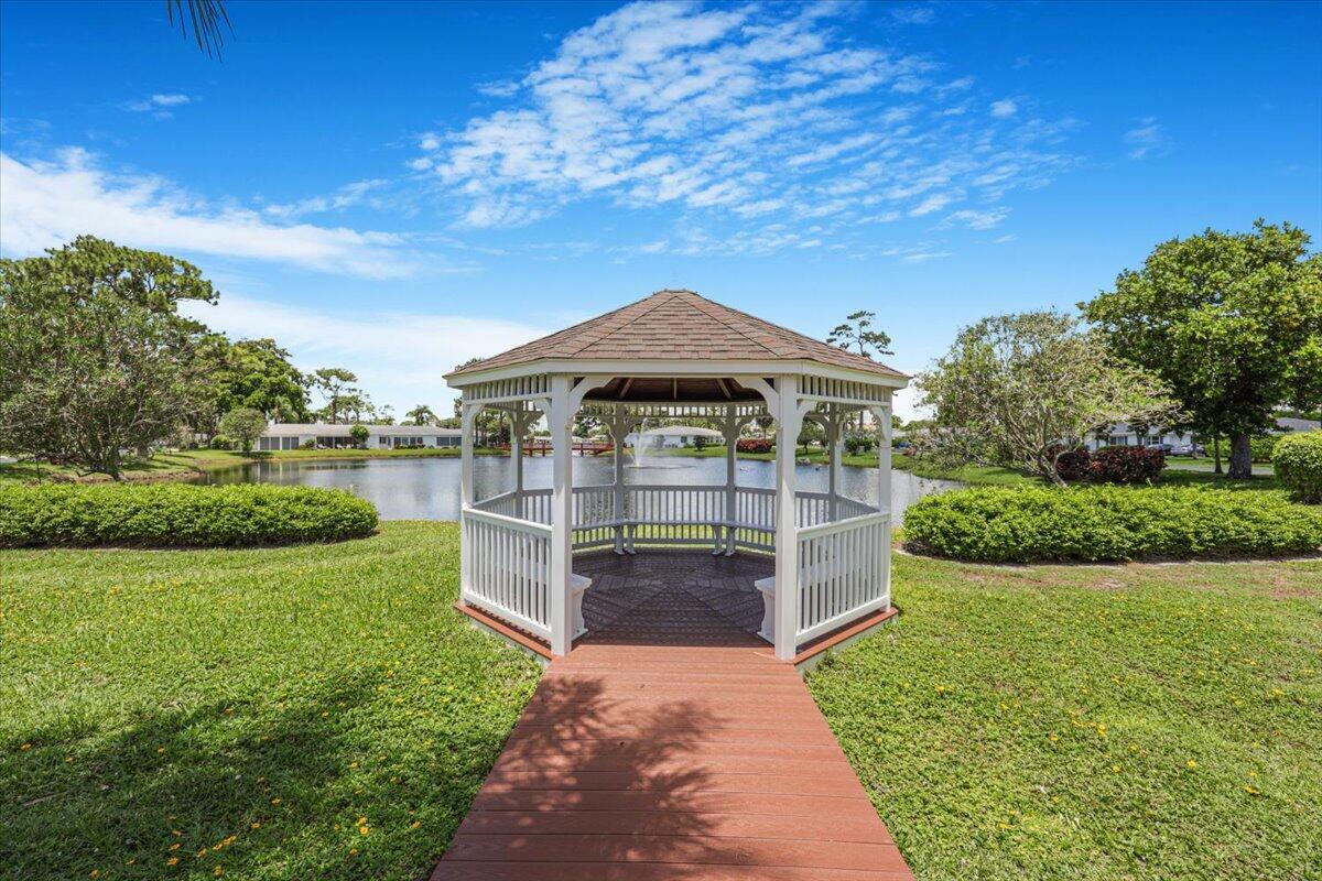 5178 Privet Place, Unit D Delray Beach, FL 33484 - Photo 36 of 41 a view of a house with garden