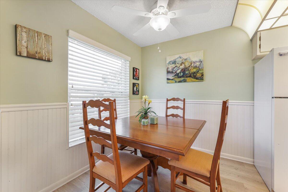 5178 Privet Place, Unit D Delray Beach, FL 33484 - Photo 7 of 41 a view of a dining room with furniture and chandelier