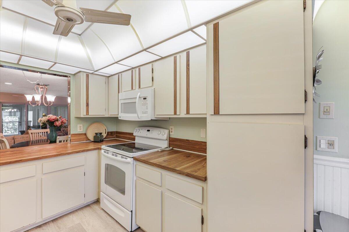 5178 Privet Place, Unit D Delray Beach, FL 33484 - Photo 9 of 41 a kitchen with a sink cabinets and window