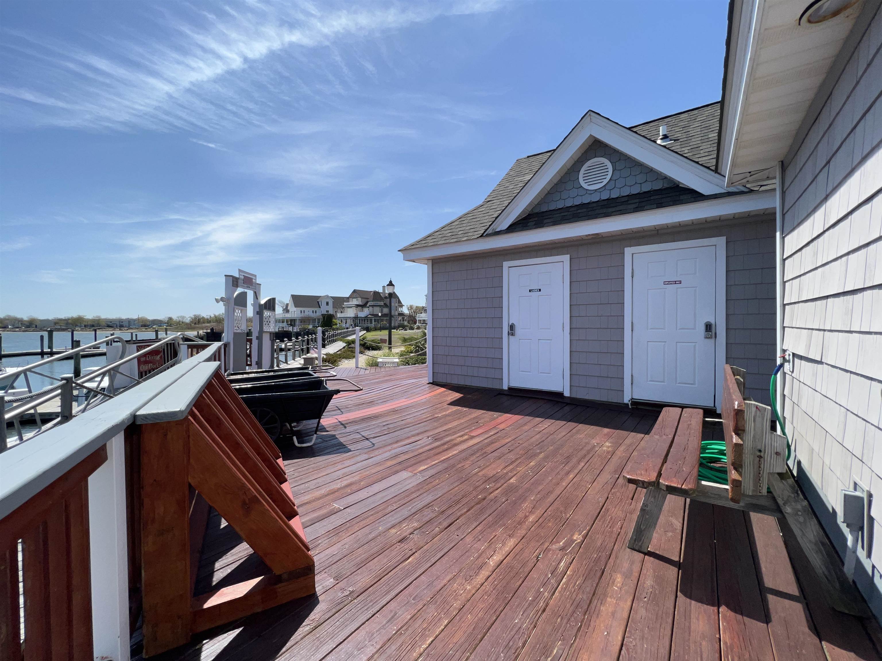 38 Harbor Lane Cape May, NJ 08204 - Photo 11 of 34 a view of a roof deck with wooden floor and fence