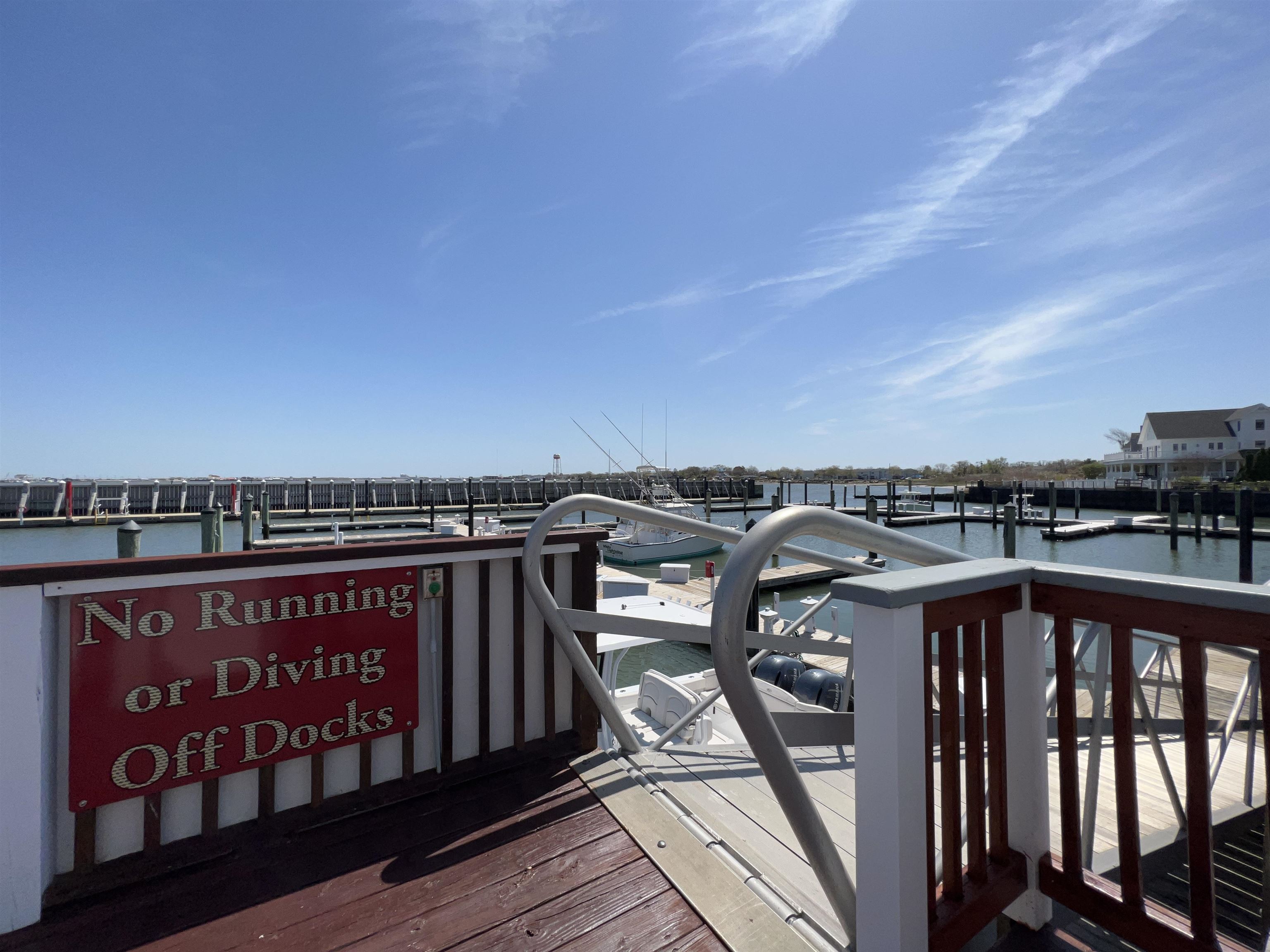 38 Harbor Lane Cape May, NJ 08204 - Photo 13 of 34 a view of a balcony with wooden floor and city view