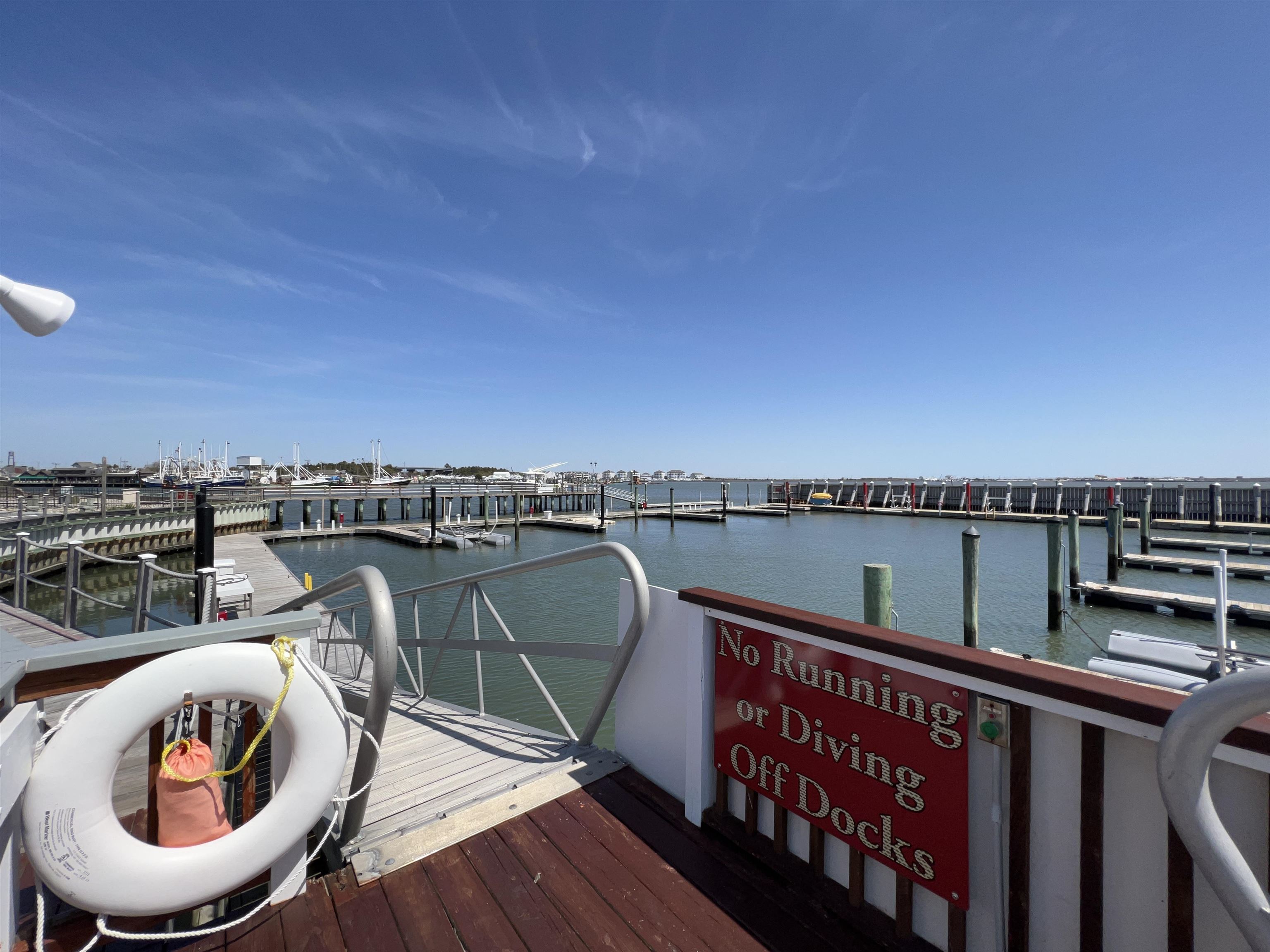 38 Harbor Lane Cape May, NJ 08204 - Photo 14 of 34 a view of a roof deck with couches and wooden floor