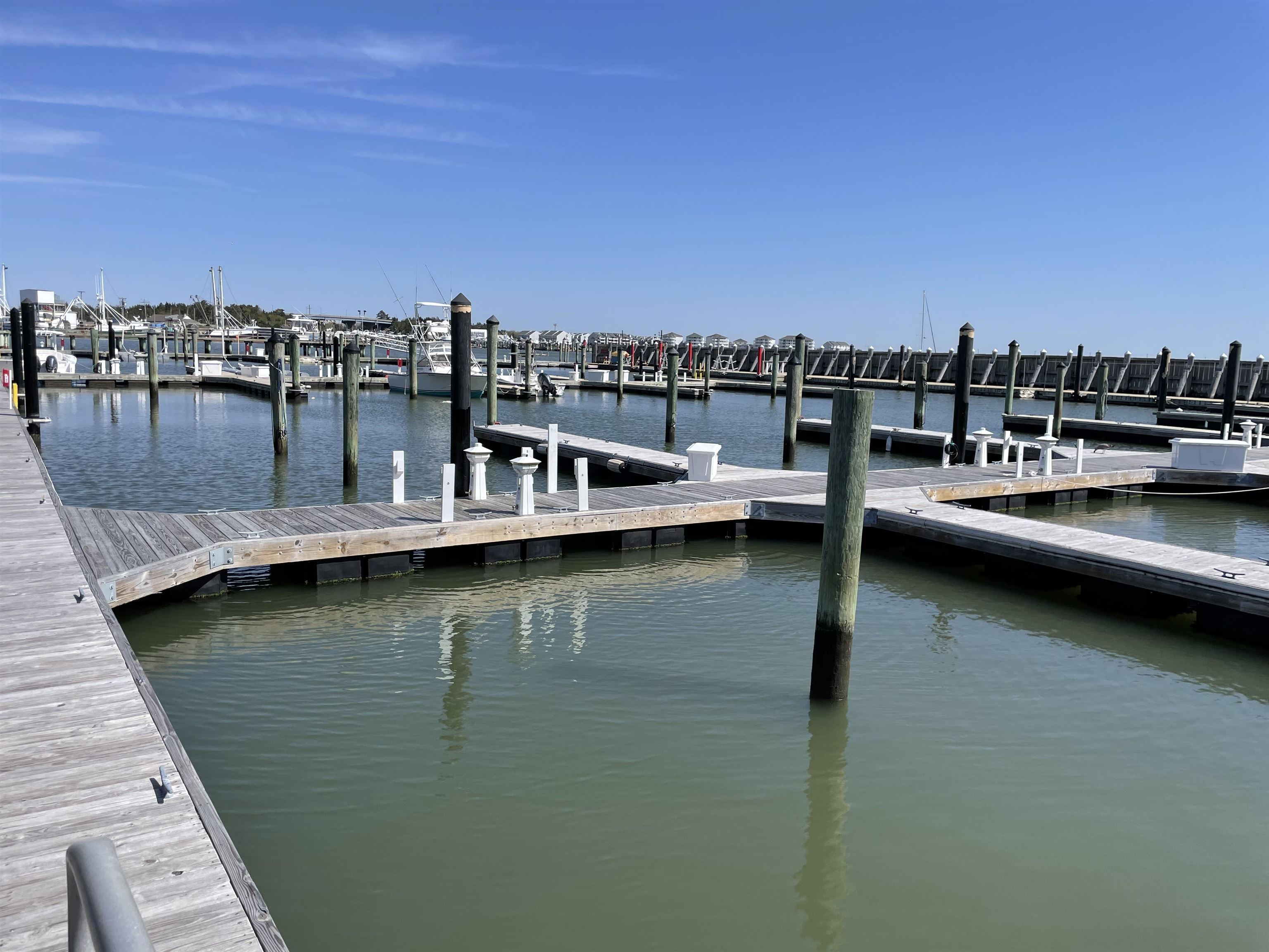38 Harbor Lane Cape May, NJ 08204 - Photo 17 of 34 a view of a lake with boats and trees in the background