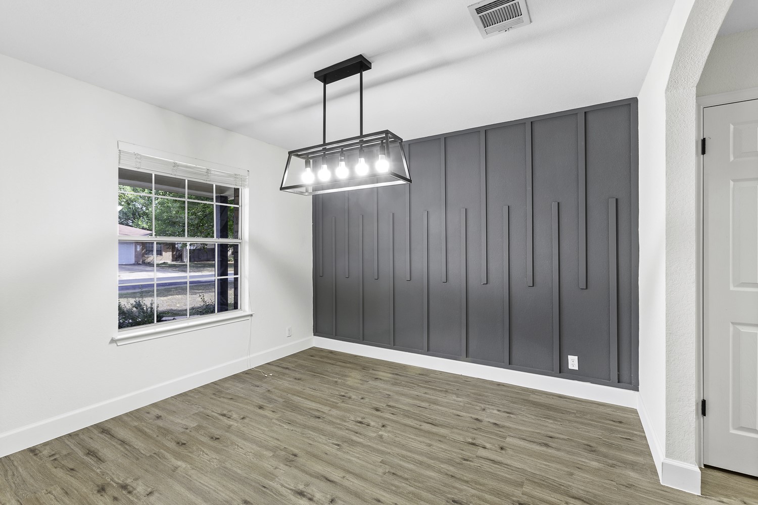 617 Barbara Way Bastrop, TX 78602 - Photo 8 of 39 Unfurnished dining area with wood finished floors and baseboards
