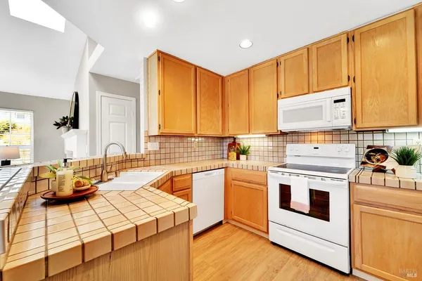 a kitchen with a stove and a sink