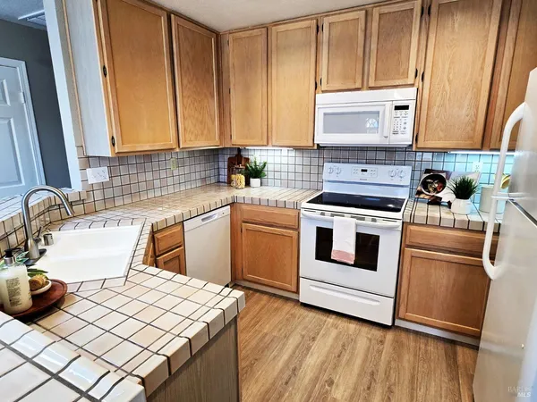 a kitchen with stainless steel appliances a refrigerator sink and cabinets