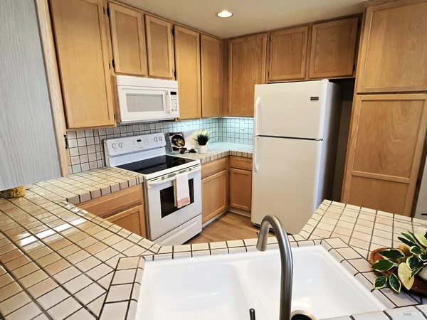 a bedroom with a bed and a large mirror