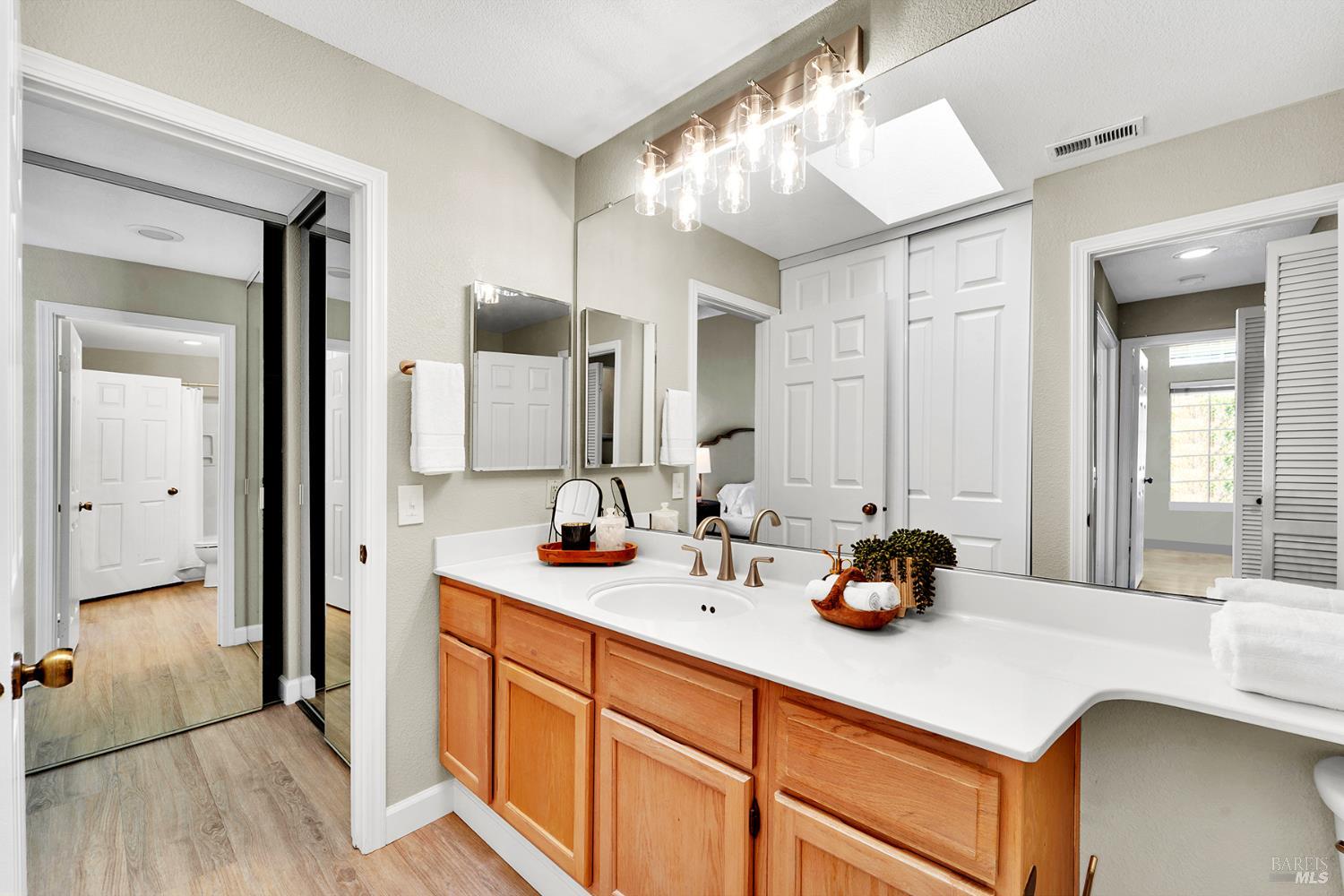 511 Timbercove Street, Unit 8 Vallejo, CA 94591 - Photo 27 of 34 a bathroom with a sink double vanity and a mirror