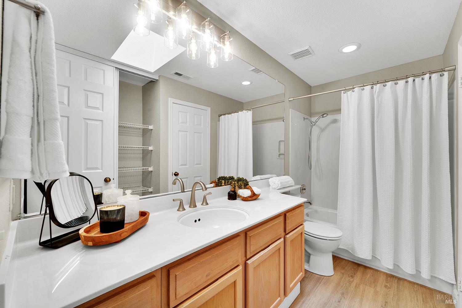 511 Timbercove Street, Unit 8 Vallejo, CA 94591 - Photo 28 of 34 a bathroom with a double vanity sink and a mirror