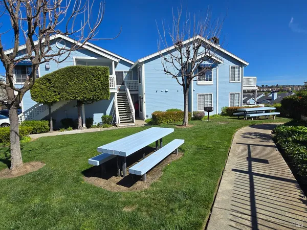 a aerial view of a house with swimming pool yard and outdoor seating