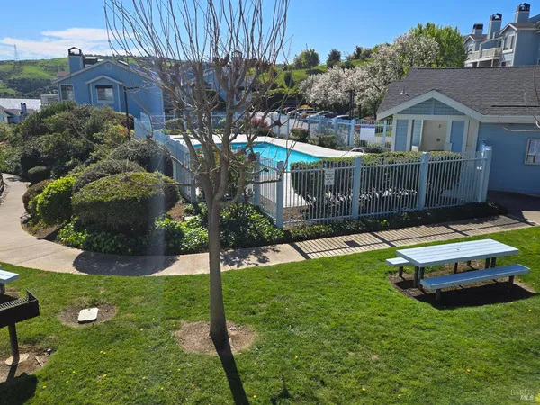 a view of a pathway with a garden