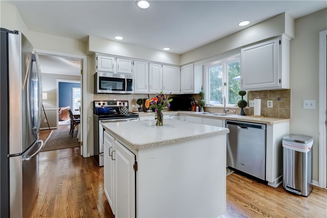 5 Hadley Drive Perinton, NY 14450 - Photo 11 of 50 Centrally located kitchen with solid surface islan