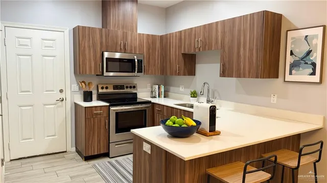 a kitchen with a sink a stove and refrigerator