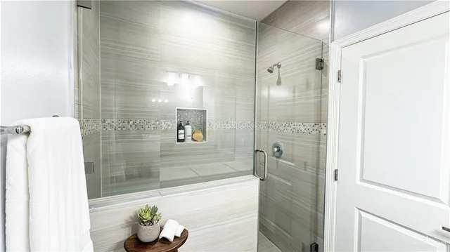 a bathroom with a tub and shower