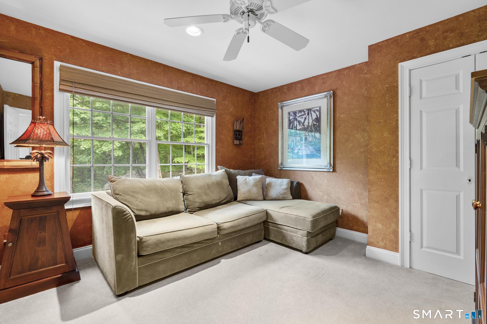 12 Logans Way Danbury, CT 06811 - Photo 29 of 40 a living room with furniture and a window