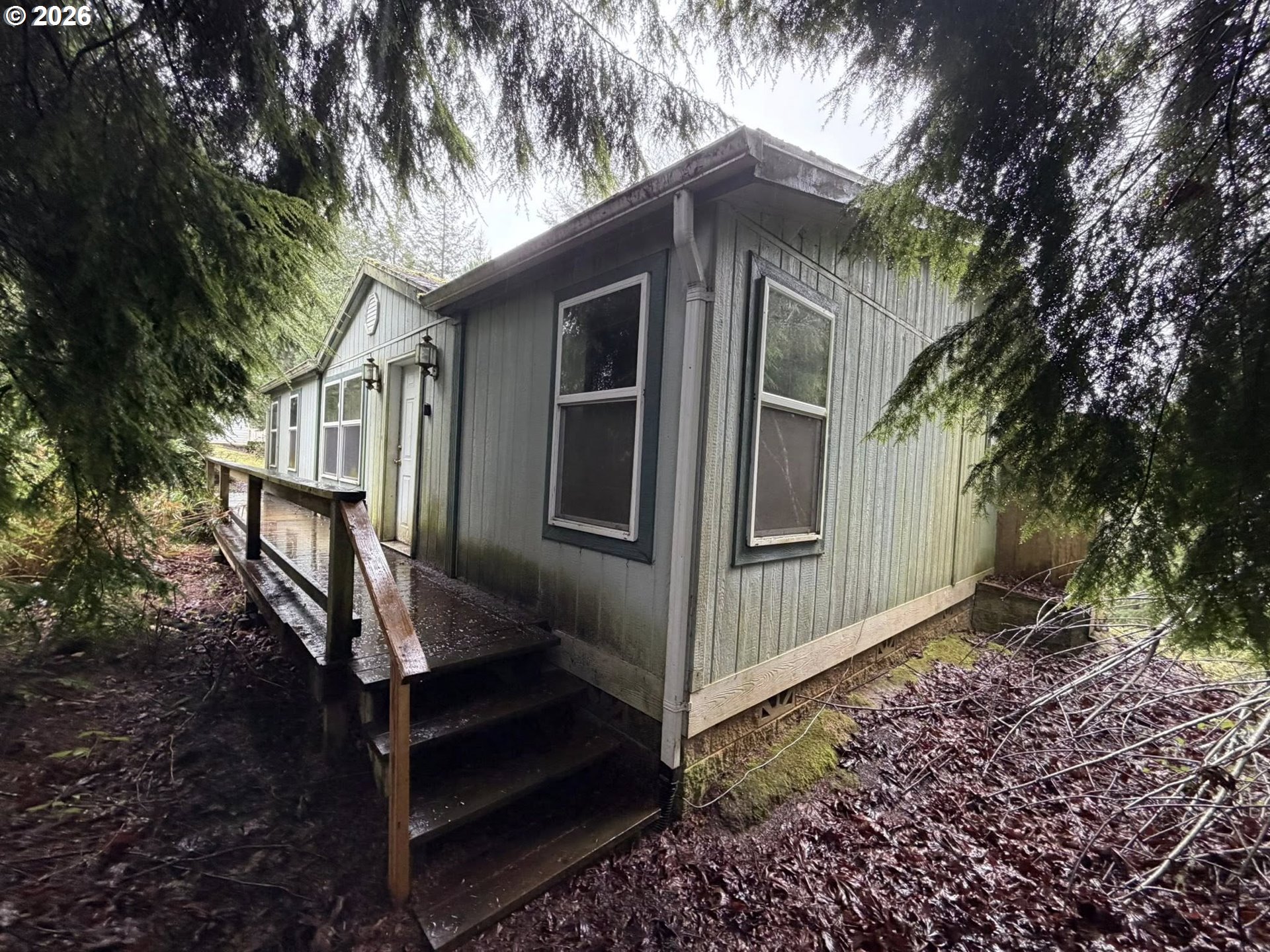 61528 Edwards Mill Road Coos Bay, OR 97420 - Photo 1 of 20 a front view of a house with garden