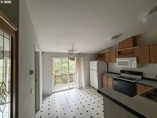 a kitchen with stainless steel appliances a refrigerator and a sink