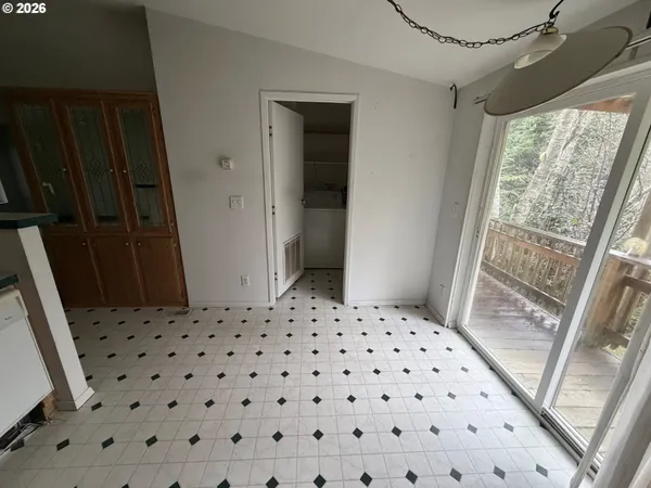 a bedroom with a rug and a window