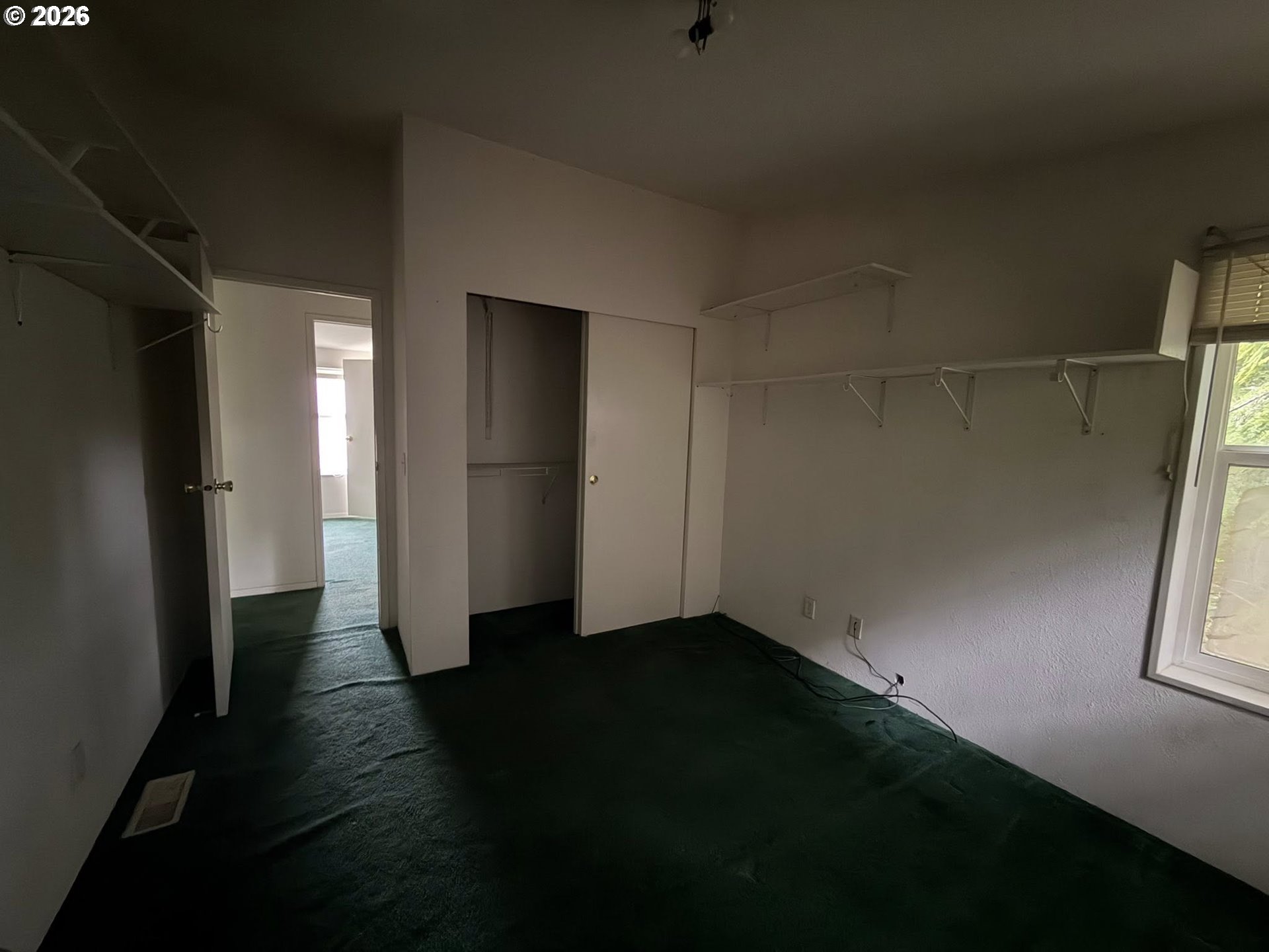 61528 Edwards Mill Road Coos Bay, OR 97420 - Photo 2 of 20 a view of hallway with window and wooden floor