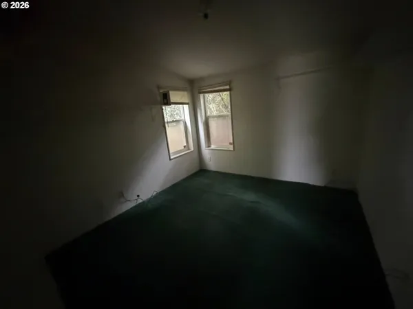 a view of an empty room and window