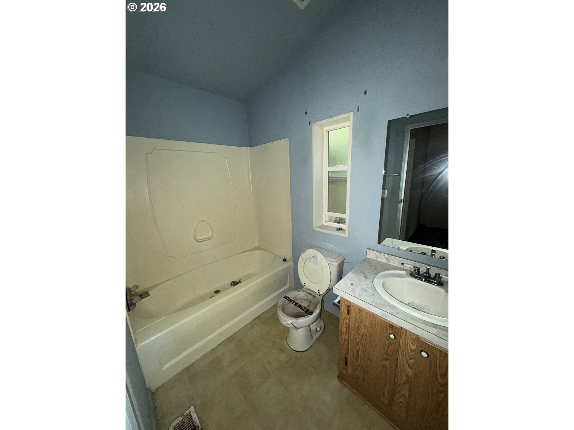 61528 Edwards Mill Road Coos Bay, OR 97420 - Photo 6 of 20 a bathroom with a granite countertop sink a toilet and shower