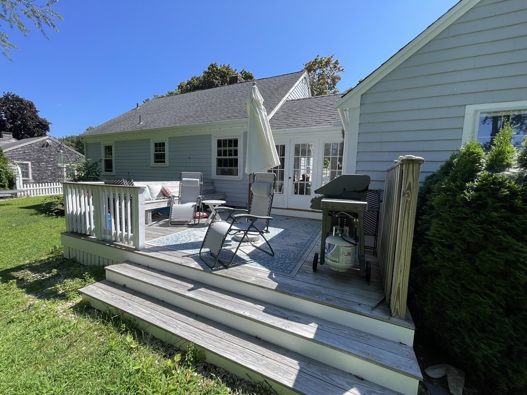 4 Riverside Drive Kingston, MA 02364 - Photo 6 of 9 a view of a house with backyard sitting area and garden
