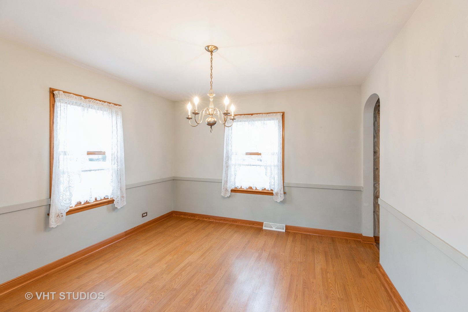 1132 Hickory Road Homewood, IL 60430 - Photo 4 of 20 a view of empty room with wooden floor and fan