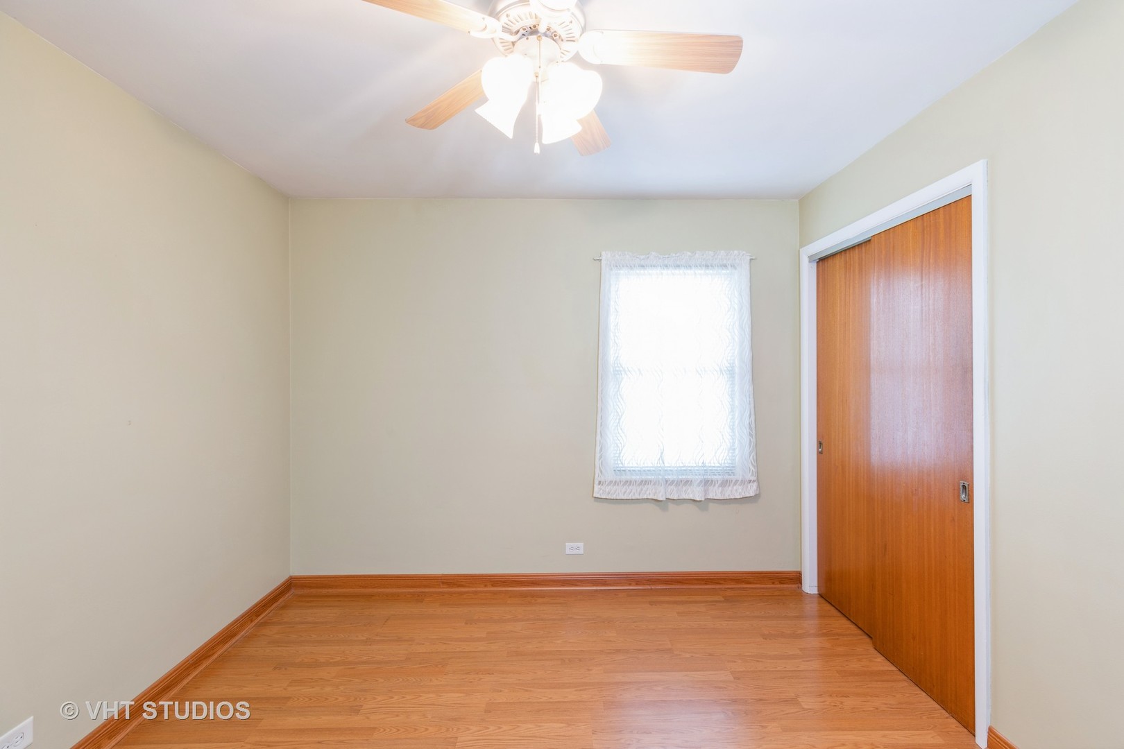 1132 Hickory Road Homewood, IL 60430 - Photo 8 of 20 an empty room with a window and a chandelier fan
