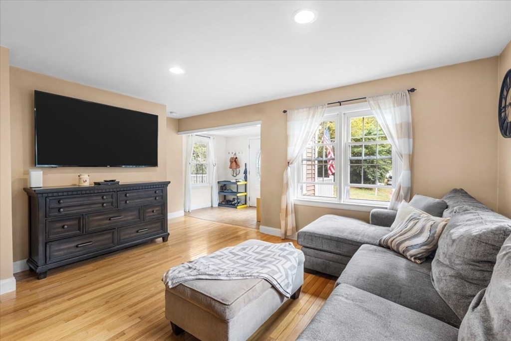 20 Cooks Lane Bellingham, MA 02019 - Photo 5 of 21 a living room with furniture and a flat screen tv
