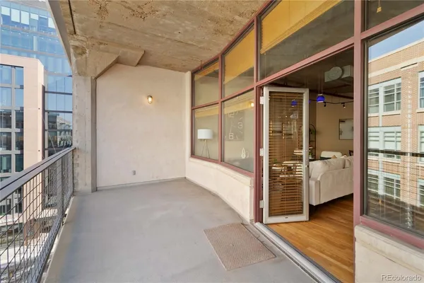 a view of a porch with hardwood