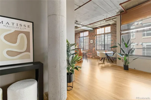 a view of living room with furniture and floor to ceiling window