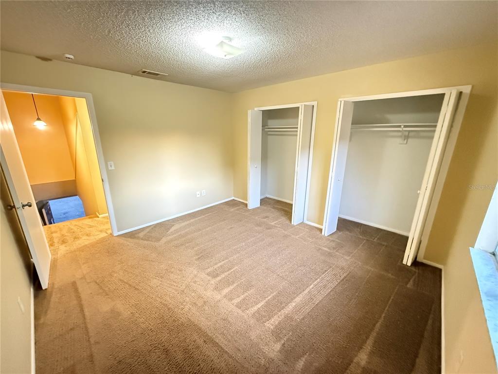 209 South Moss Road, Unit 209 Winter Springs, FL 32708 - Photo 12 of 14 a view of an empty room with wooden floor