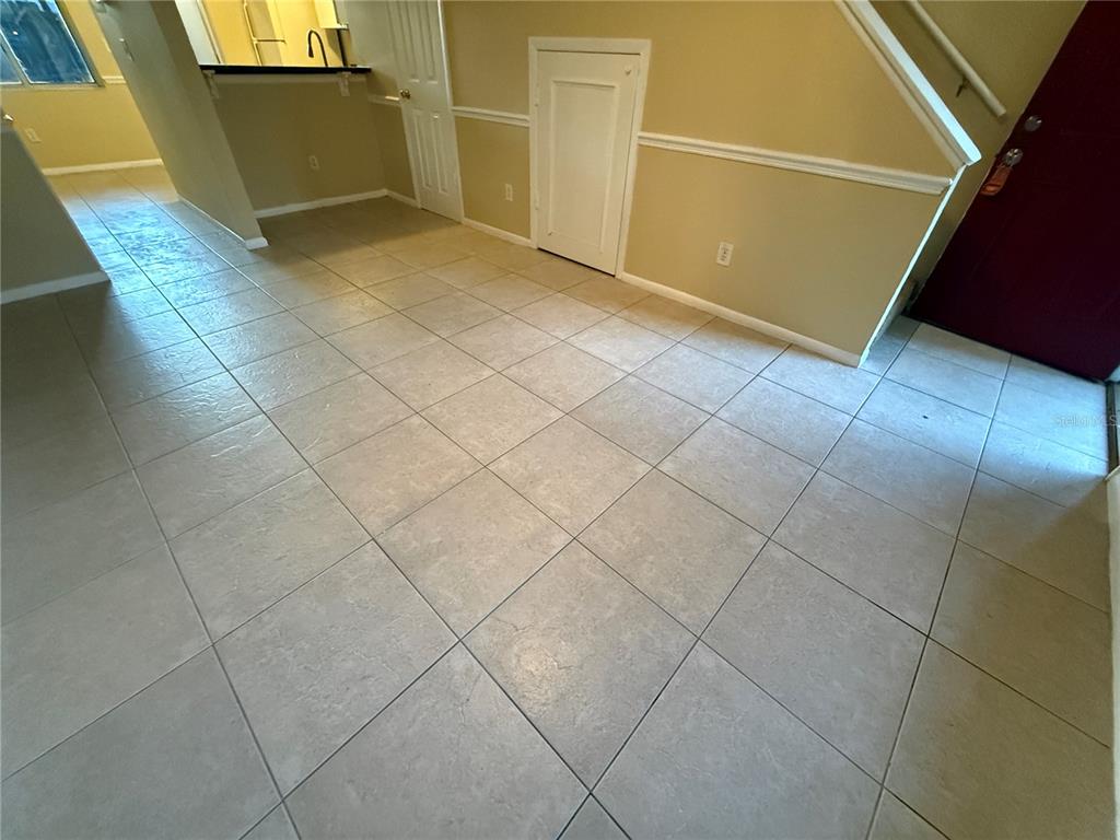 209 South Moss Road, Unit 209 Winter Springs, FL 32708 - Photo 5 of 14 a view of a livingroom with kitchen and window