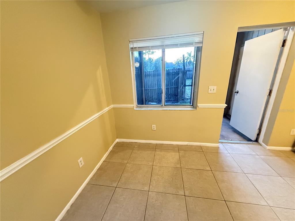 209 South Moss Road, Unit 209 Winter Springs, FL 32708 - Photo 6 of 14 a view of an empty room with glass door