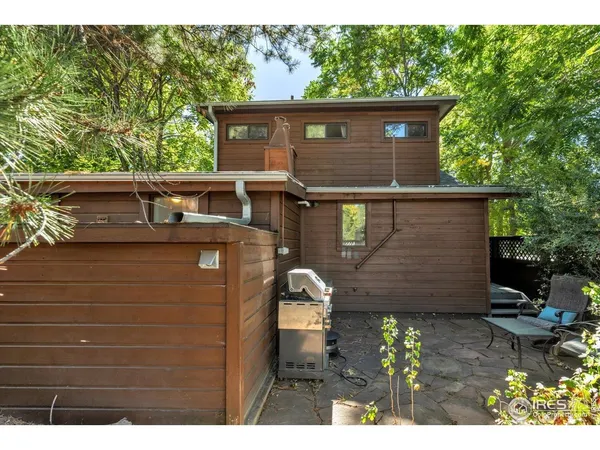 a side view of a house with a yard
