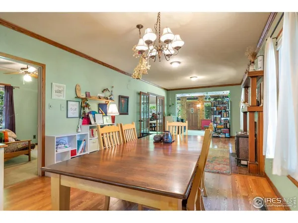 a view of a dining room with furniture and a livingroom