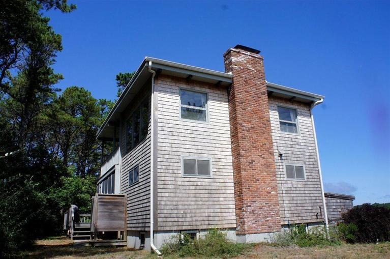 140 Fox Island Road Wellfleet, MA 02667 - Photo 20 of 23 a view of a house with a garage