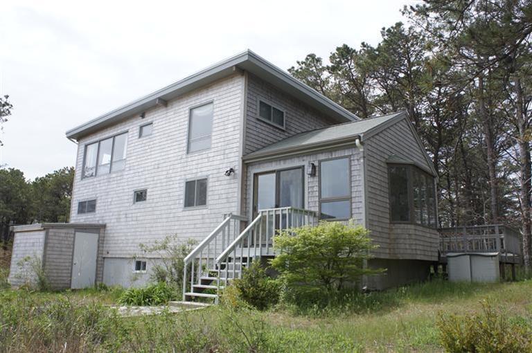 140 Fox Island Road Wellfleet, MA 02667 - Photo 22 of 23 a view of a house with a yard
