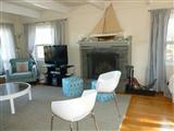 140 Fox Island Road Wellfleet, MA 02667 - Photo 8 of 23 a living room with furniture and a fireplace