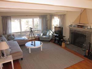140 Fox Island Road Wellfleet, MA 02667 - Photo 10 of 23 a living room with furniture and a fireplace