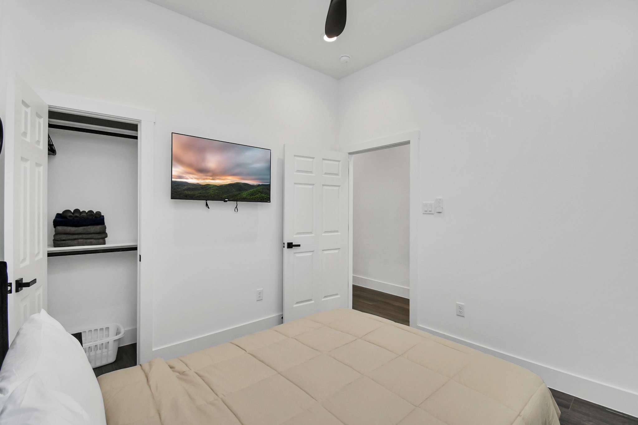 4909 Higgins Street, Unit A Houston, TX 77033 - Photo 13 of 32 a bedroom with a bed and a flat screen tv