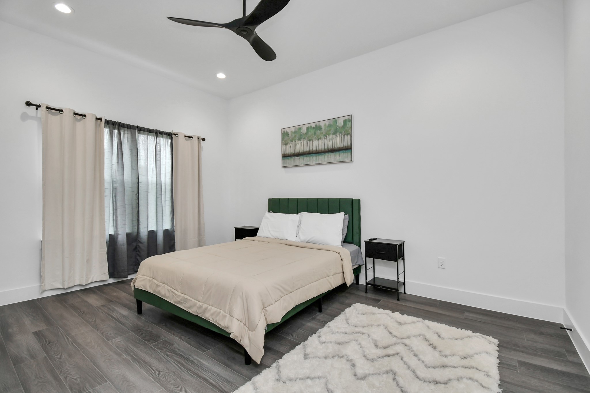 4909 Higgins Street, Unit A Houston, TX 77033 - Photo 15 of 32 a bedroom with a bed and a window