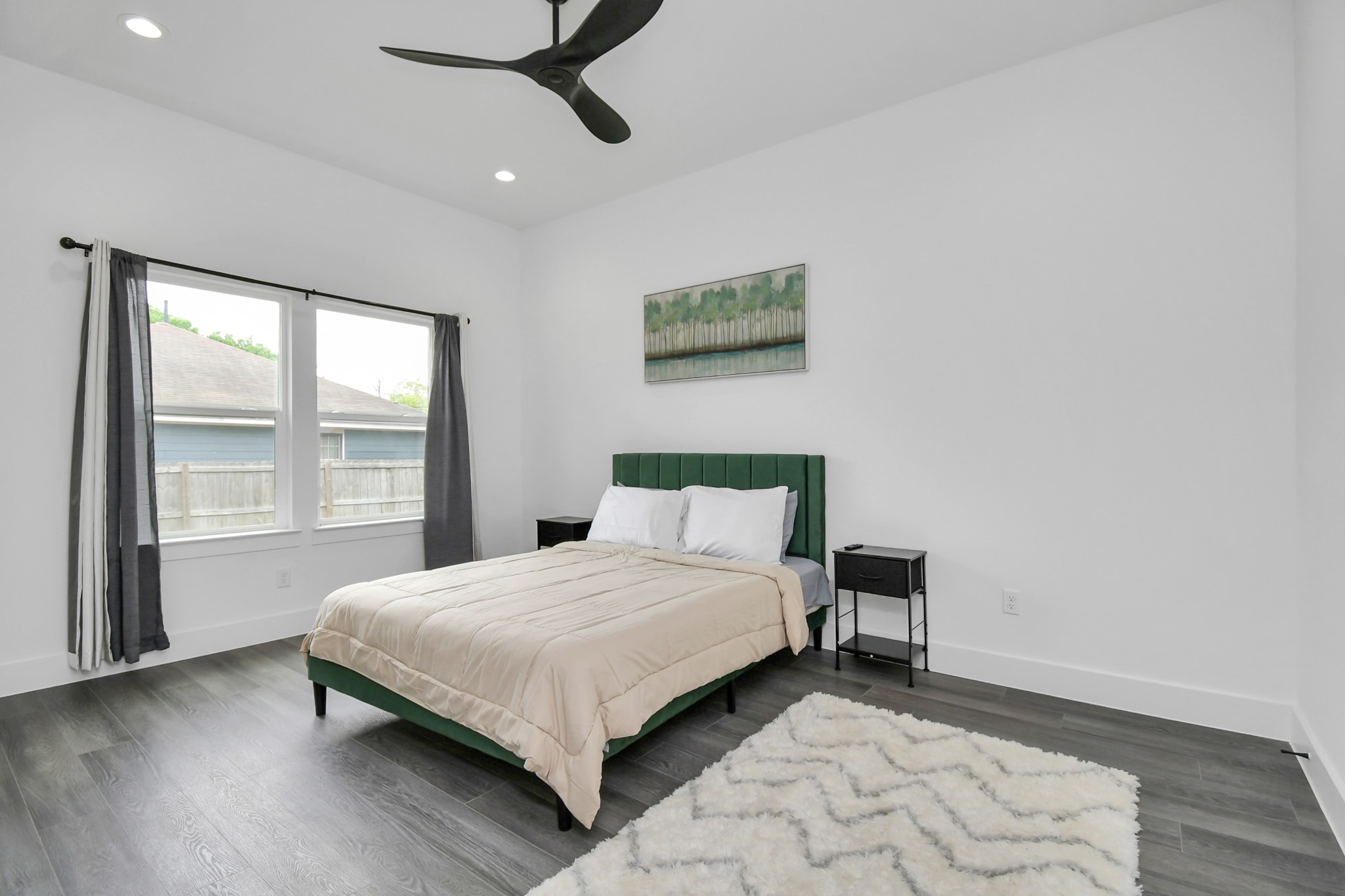 4909 Higgins Street, Unit A Houston, TX 77033 - Photo 19 of 32 a bedroom with a bed and a window