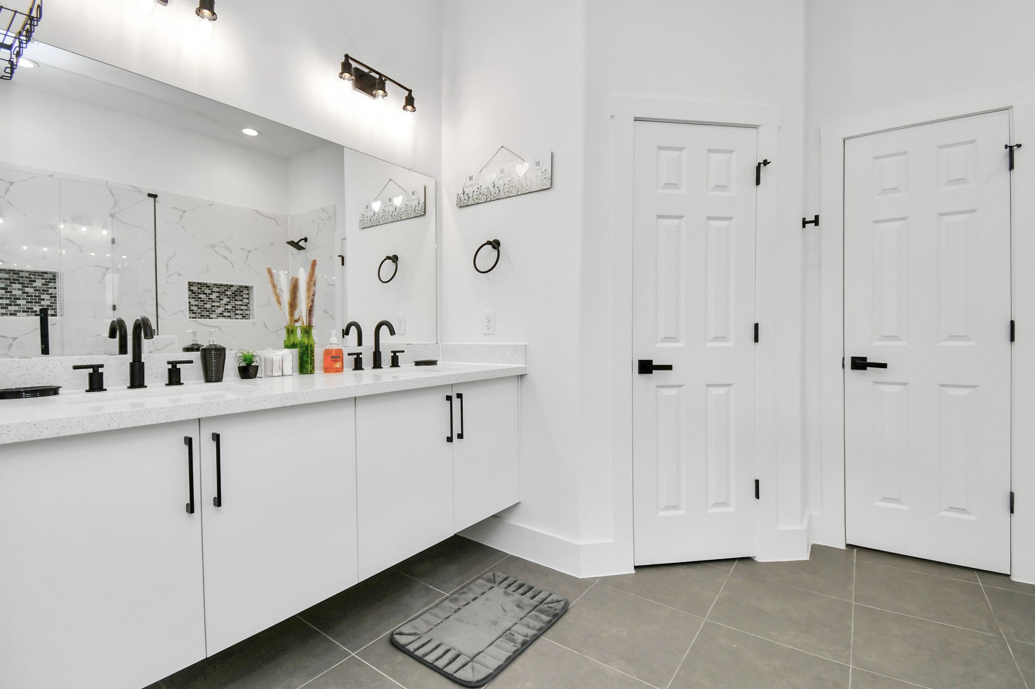 4909 Higgins Street, Unit A Houston, TX 77033 - Photo 20 of 32 a kitchen with white cabinets and white appliances