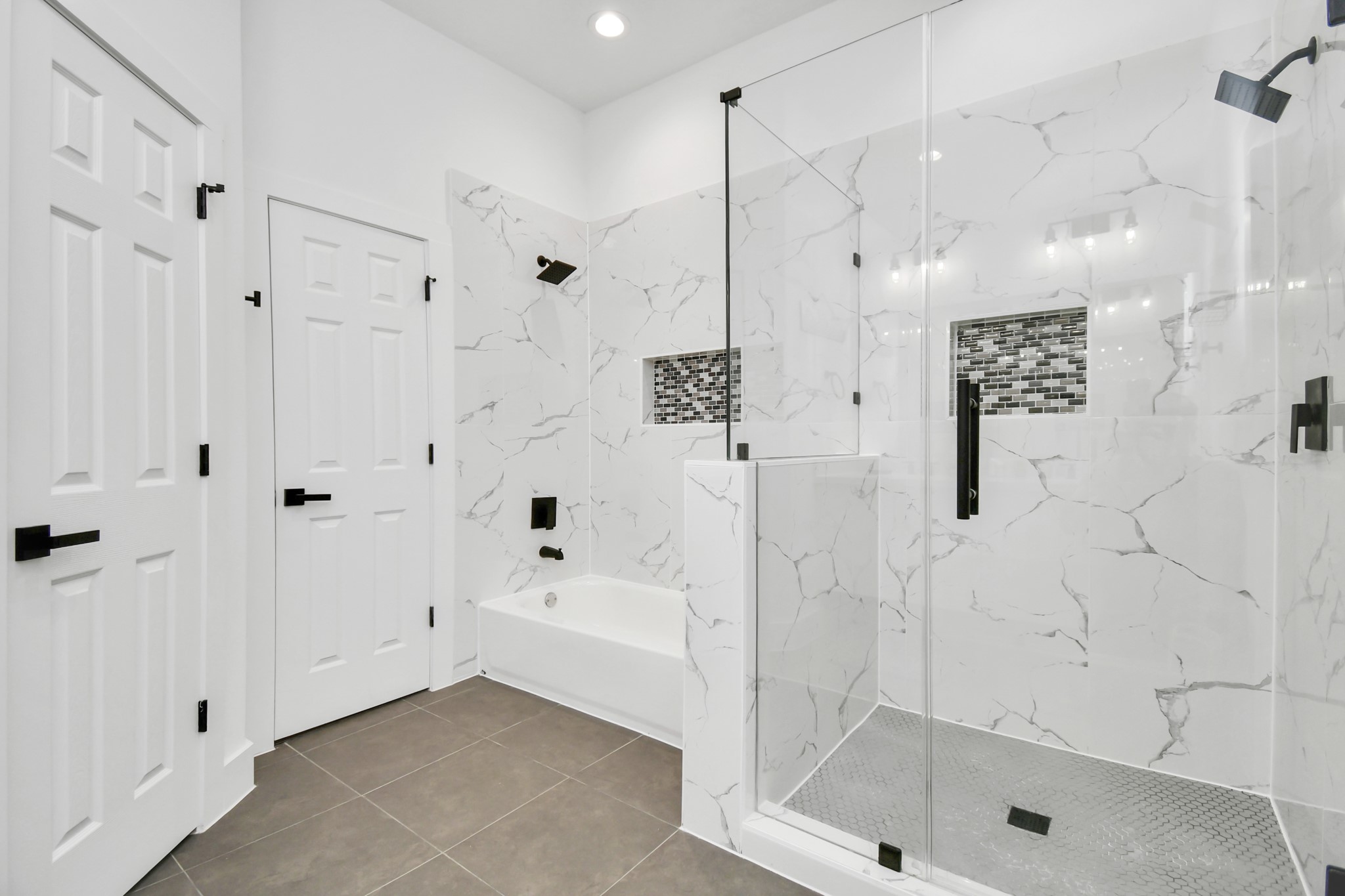 4909 Higgins Street, Unit A Houston, TX 77033 - Photo 26 of 32 a bathroom with a bathtub and a shower
